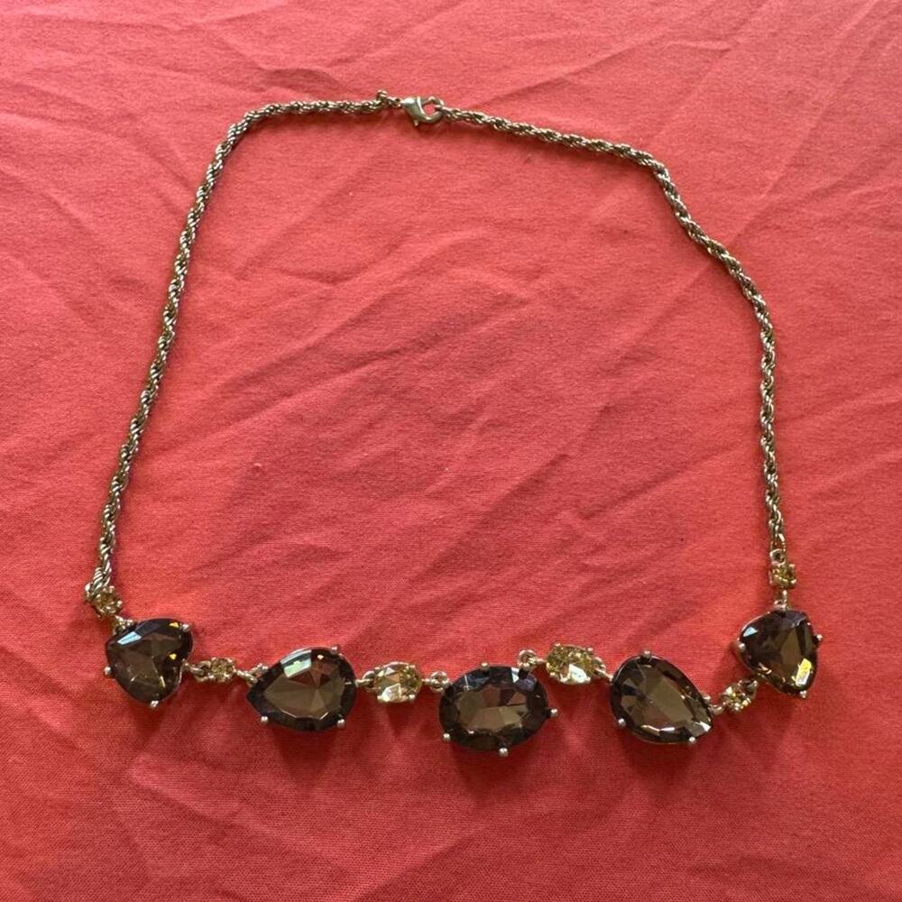 Gold toned chain necklace wfive darkbrown teardrop-shaped stones wsmaller stones